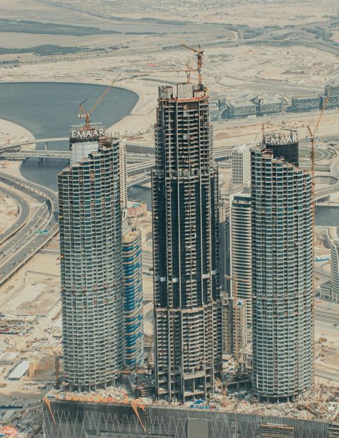 Aerial view of construction in downtown Dubai showcasing modern skyscrapers and urban development.