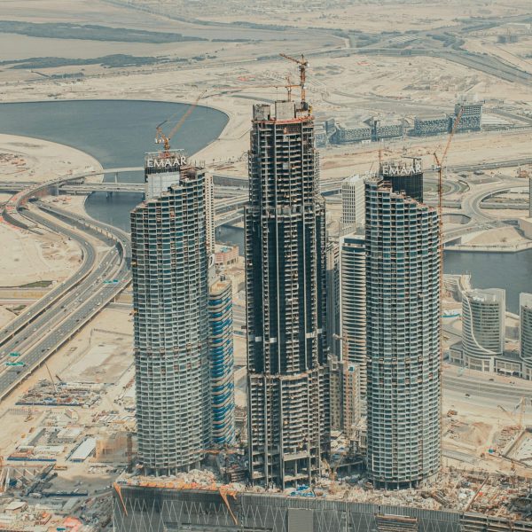 Aerial view of construction in downtown Dubai showcasing modern skyscrapers and urban development.